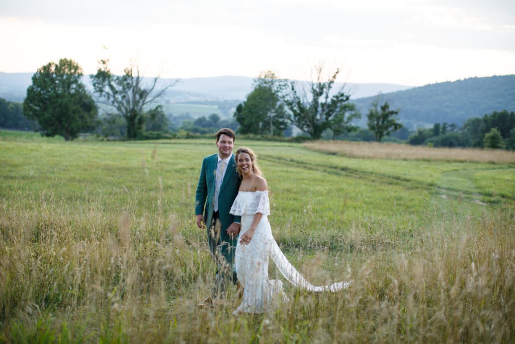 Bride and Groom in a field at Sunset How to Host a Wedding at Home Canvas Weddings