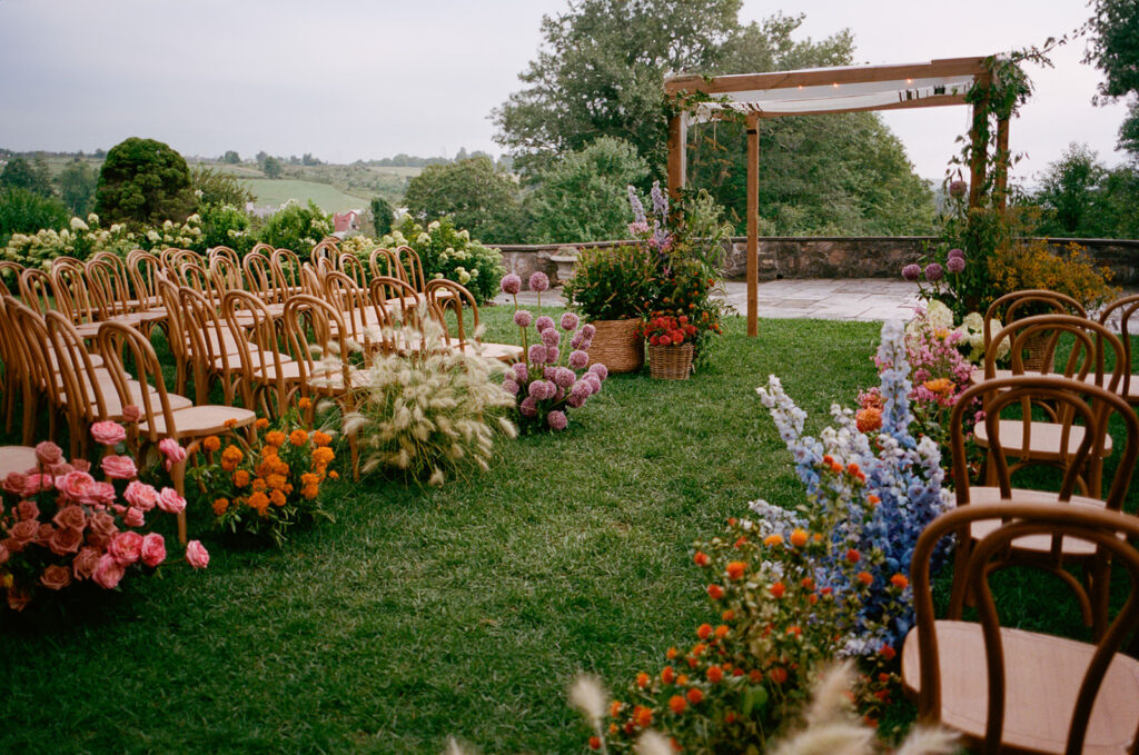 outdoor ceremony space with color-blocked flowers at Glynwood Farm wedding venue