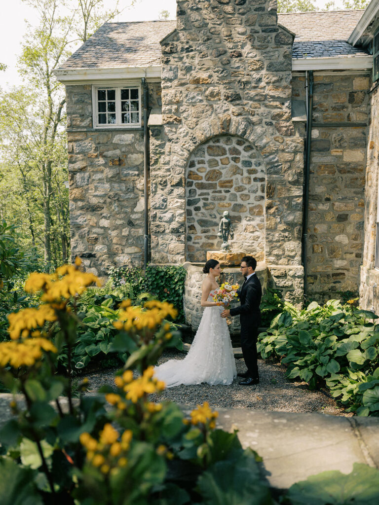 bride and groom exchange intimate moment in the garden