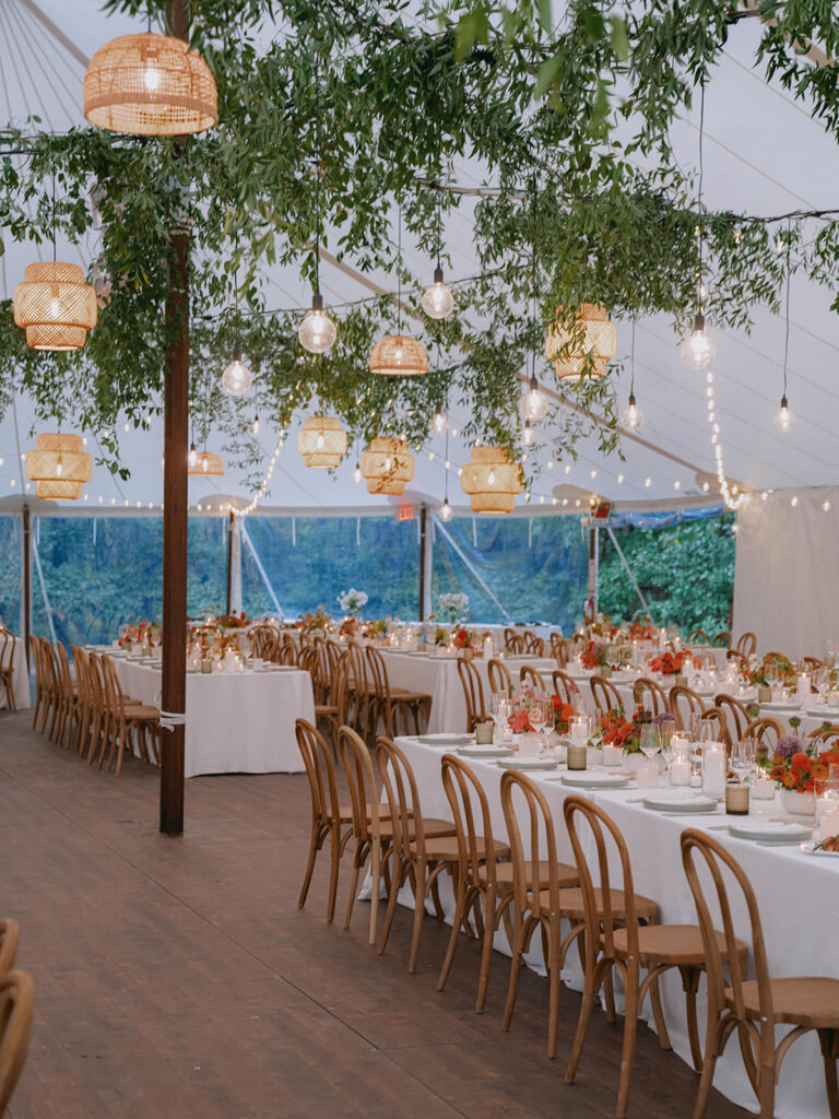 sailcloth tent wedding reception with hanging greenery, lanterns and string lights
